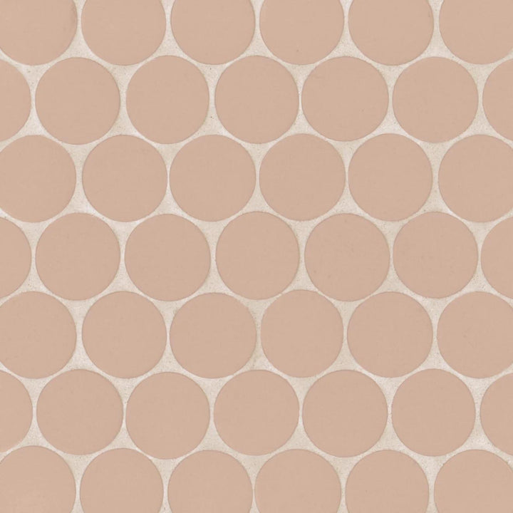 Aerial shot of Makoto Momoiro Blush 2" Round Matte Porcelain Mosaic, presenting soft blush pink hues with a modern matte surface.