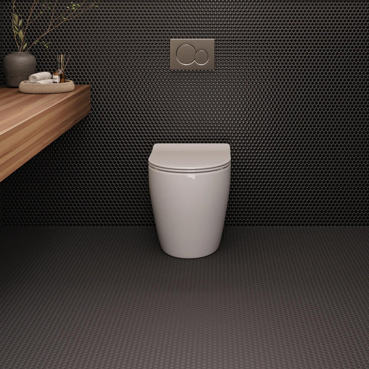 With a sleek, polished surface, Le Café Black 3/4" penny round gloss porcelain mosaic offers a luminous touch for sophisticated interiors.