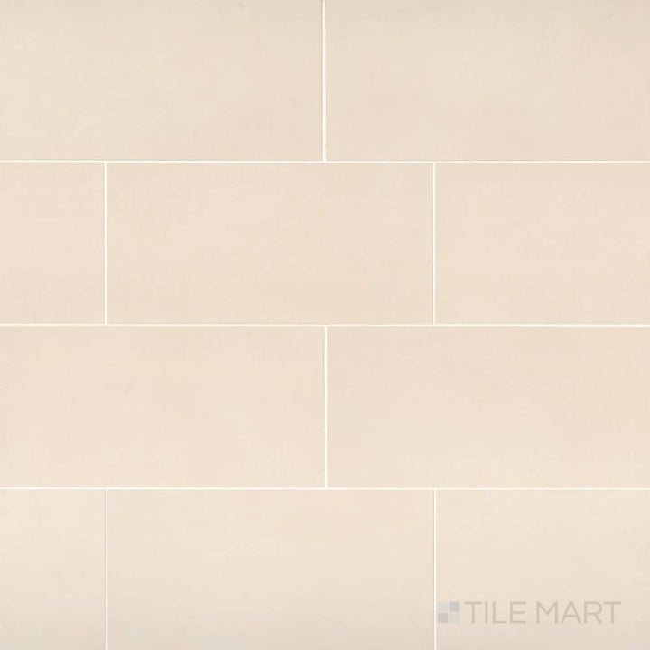 The Sahara White 12x24 matte porcelain tile displayed in an elegant layout, capturing its soft white stone appearance and clean matte finish.