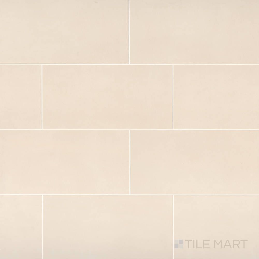 The Sahara White 12x24 matte porcelain tile displayed in an elegant layout, capturing its soft white stone appearance and clean matte finish.