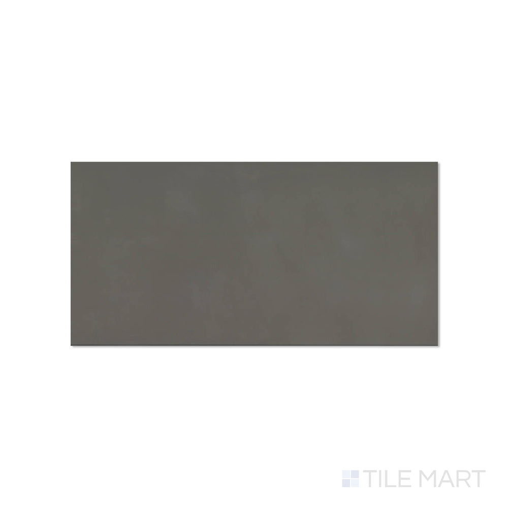 Top-down view of Sahara Dark 12x24 matte porcelain tile, revealing deep charcoal tones with a modern matte finish.