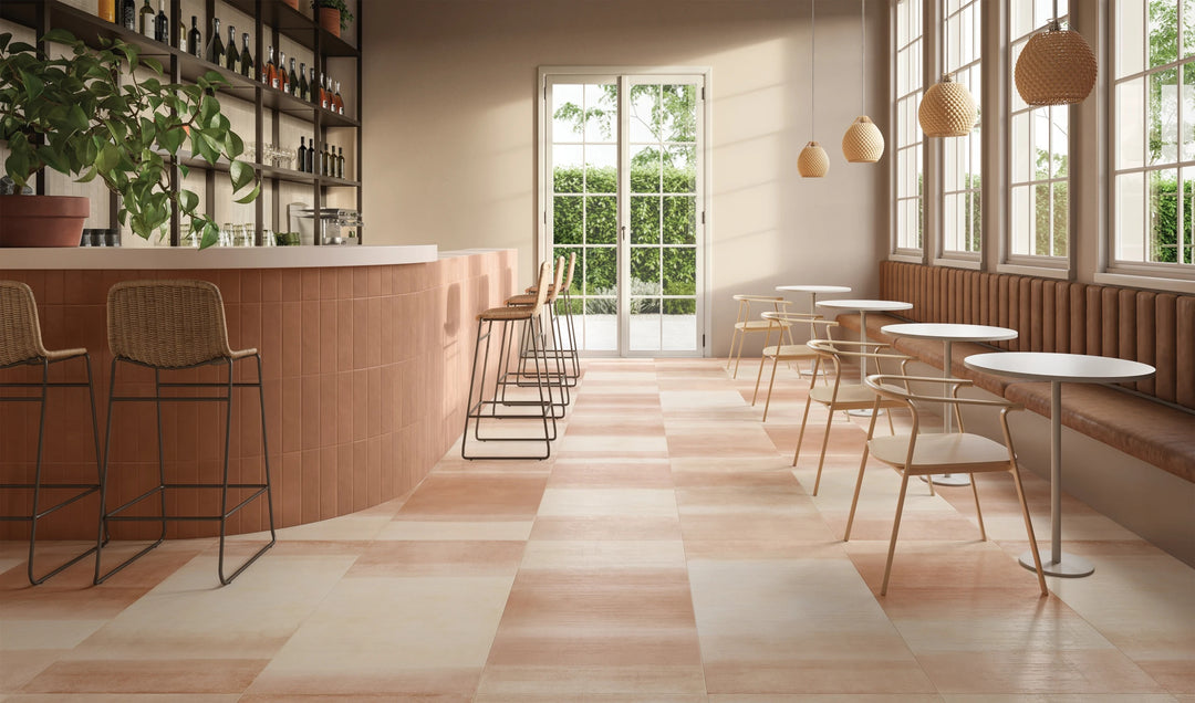 Sahara Cotto 3x12 matte porcelain tile with warm, rustic tones shown in a styled surface installation.
