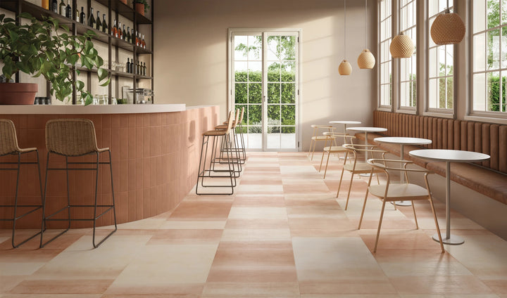 Sahara Cotto 3x12 matte porcelain tile with warm, rustic tones shown in a styled surface installation.