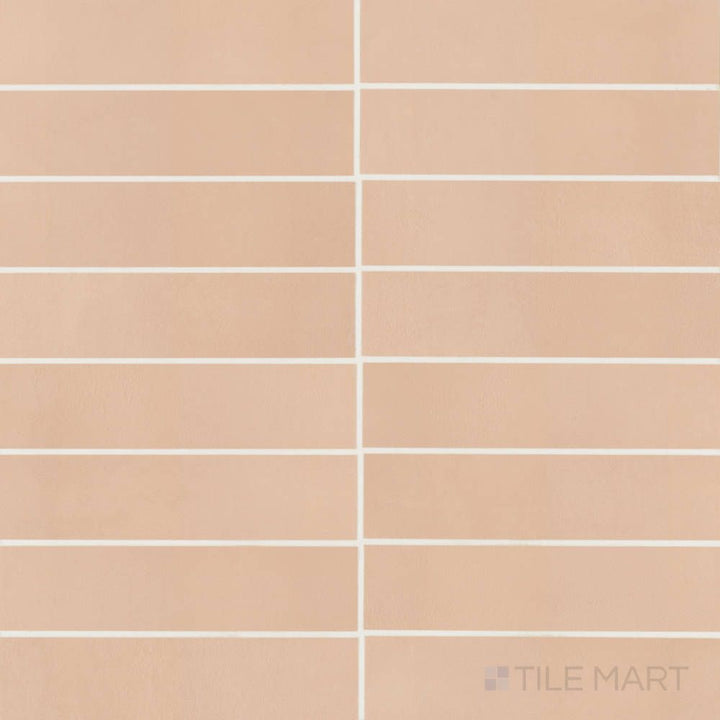 Overview of Sahara Rose 3x12 matte porcelain tile, showing warm blush stone tones in a sleek, linear tile design.
