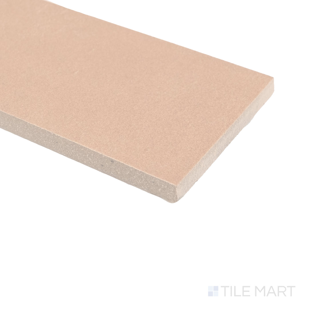 Corner angle of Sahara Rose matte porcelain tile capturing its blush hue and refined surface texture.