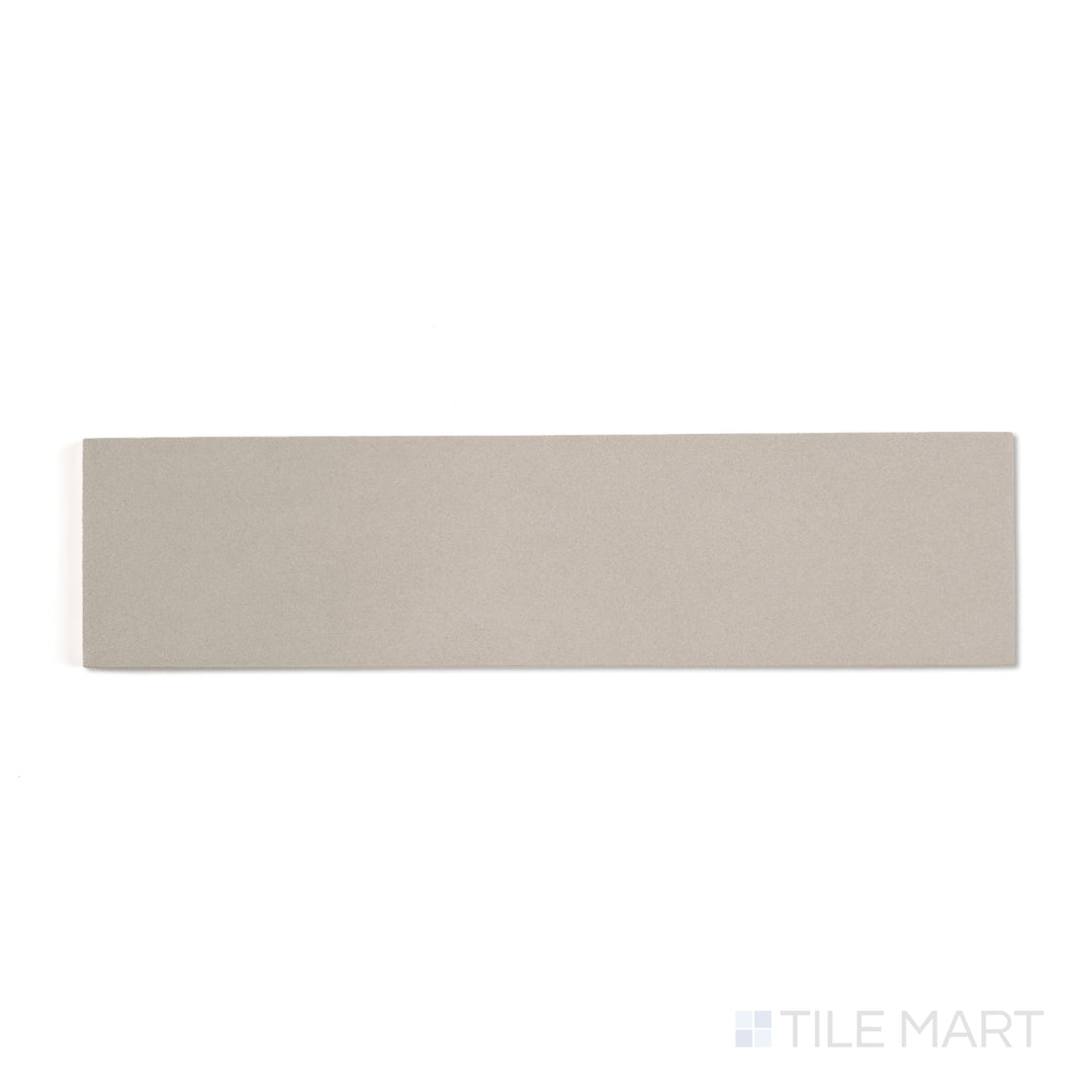 Sahara Grey 3x12 matte porcelain tile in a top-down view, presenting cool grey shades in a sleek linear shape.