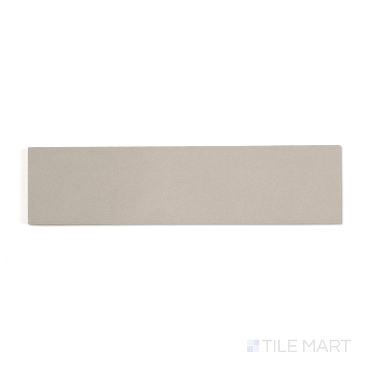 Sahara Grey 3x12 matte porcelain tile in a top-down view, presenting cool grey shades in a sleek linear shape.