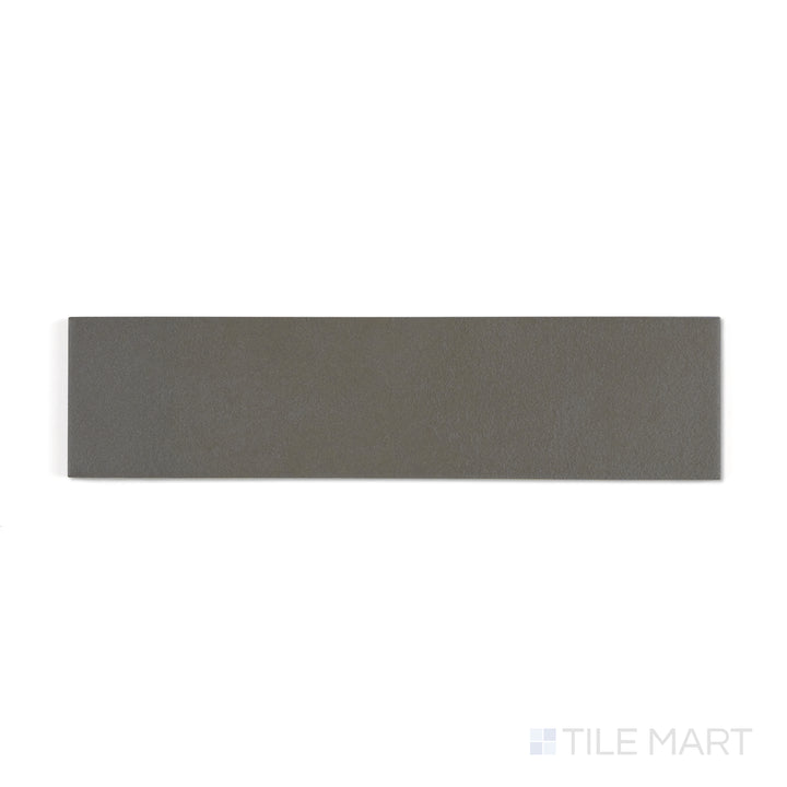 Top-down perspective of Sahara Dark 3x12 matte porcelain tile, highlighting deep charcoal hues with a refined matte finish.