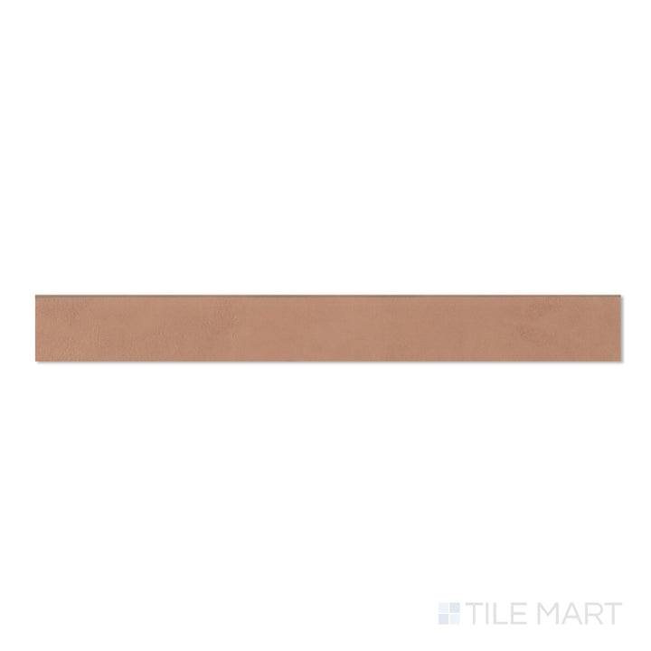 Top-down view of Sahara Cotto 3x24 matte porcelain bullnose tile, showing terracotta tones and a smooth rounded edge.