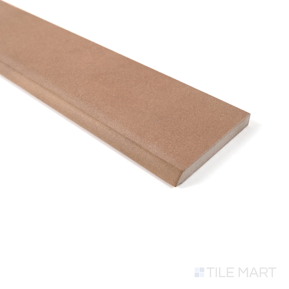 Close-up of Sahara Cotto matte porcelain bullnose tile showing its warm tone and smooth edge finish.