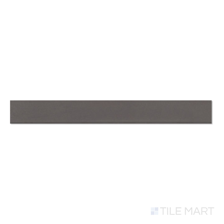 Flat lay of Sahara Dark 3x24 matte porcelain bullnose tile, emphasizing deep charcoal coloring and a polished bullnose edge.