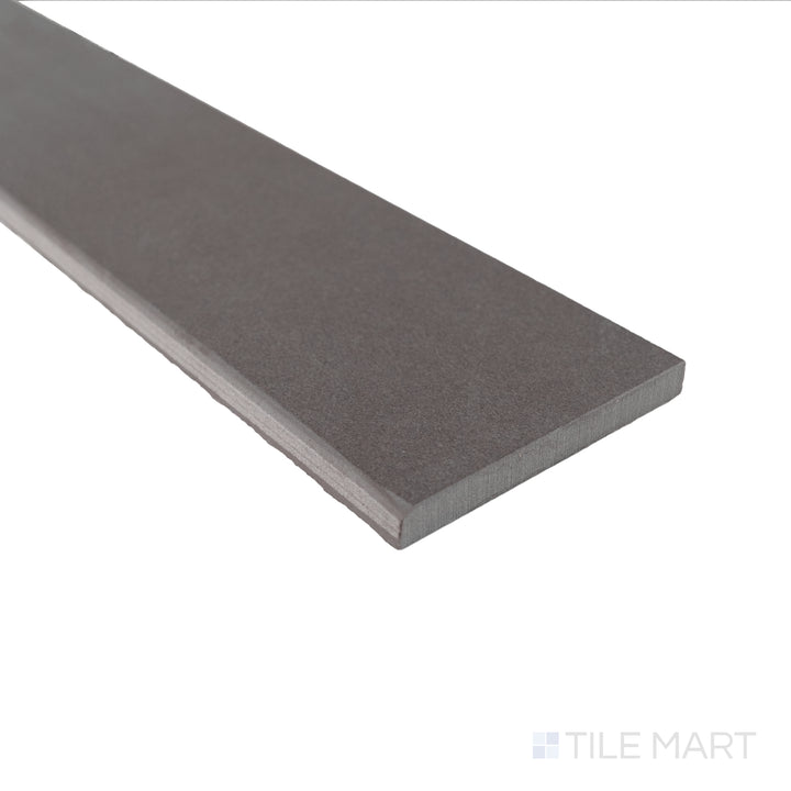 Close-up of Sahara Dark matte porcelain bullnose tile showcasing its deep shade and smooth rounded finish.
