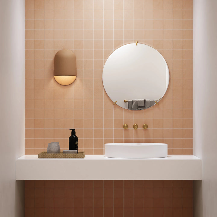 Sahara Cotto 4" square matte porcelain mosaic shown with warm tones in a decorative tile layout.