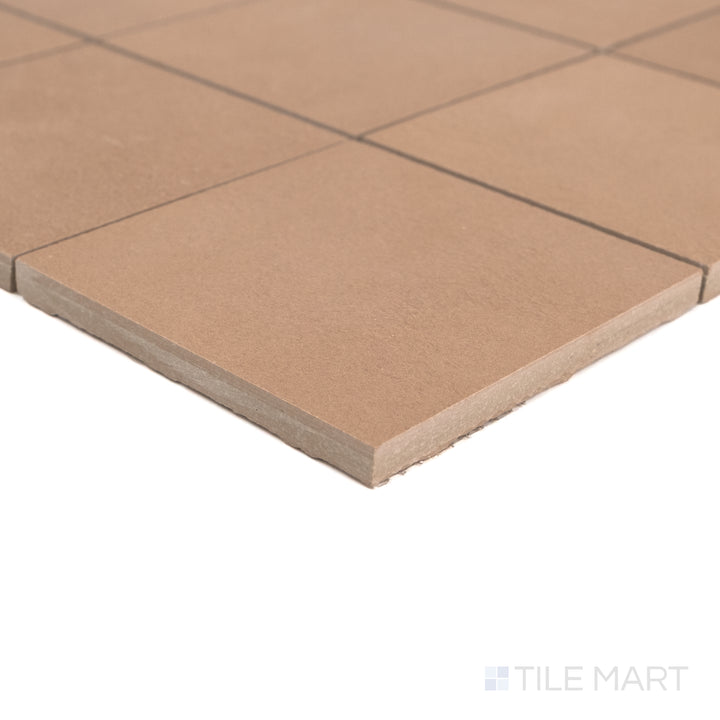 Corner close-up of Sahara Cotto 4" square matte porcelain mosaic showing warm tone and subtle surface texture.