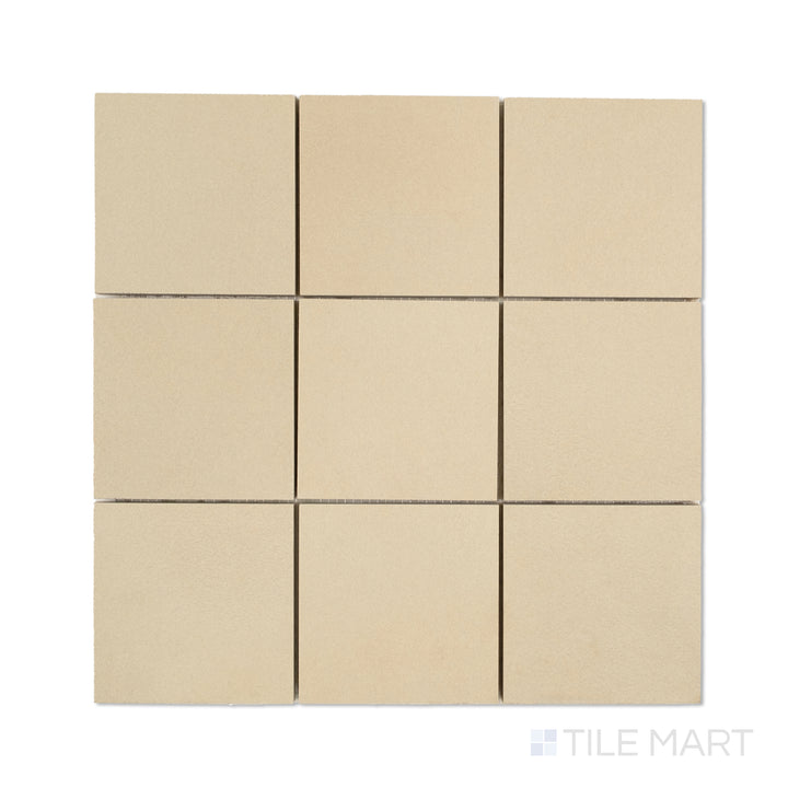 Overhead shot of Sahara Ecru 4-inch square matte porcelain mosaic, displaying warm beige tones in a symmetrical square tile layout.