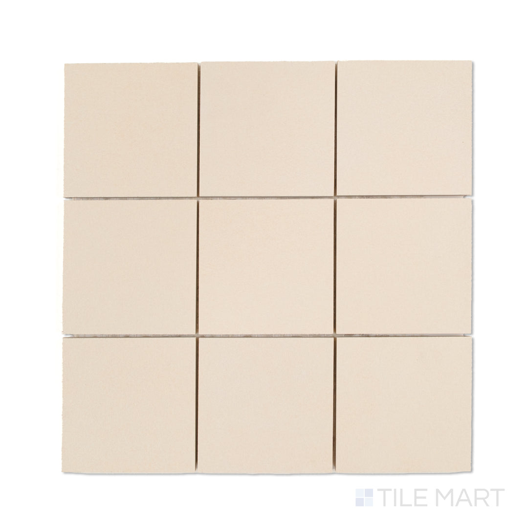 Top-down photo of Sahara White 4-inch square matte porcelain mosaic, offering crisp white tiles in a neat square mosaic design.