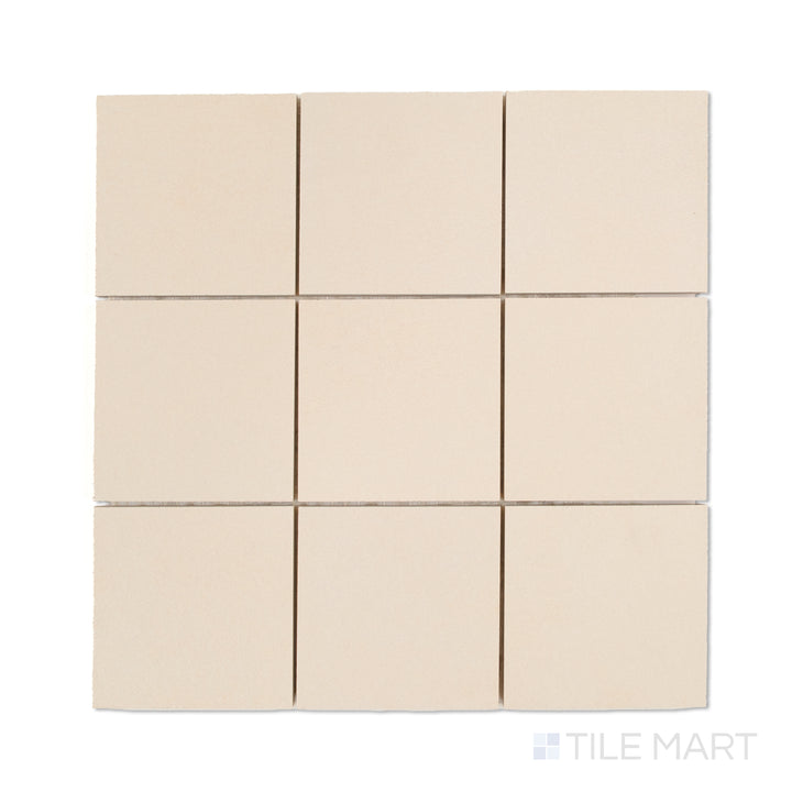Top-down photo of Sahara White 4-inch square matte porcelain mosaic, offering crisp white tiles in a neat square mosaic design.
