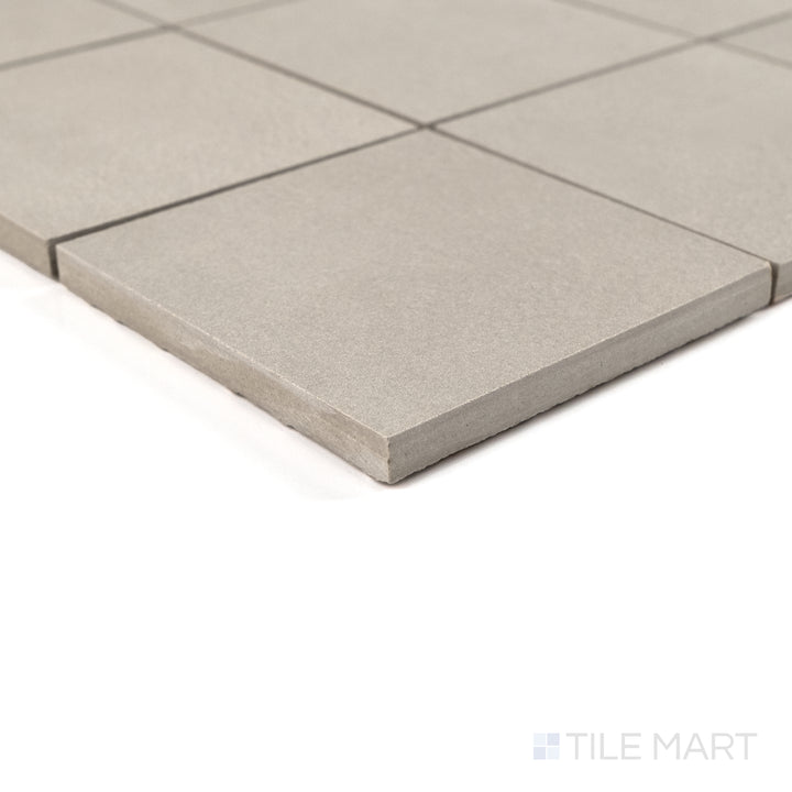 Corner detail of Sahara Grey 4" square matte porcelain mosaic highlighting its neutral tone and soft surface texture.