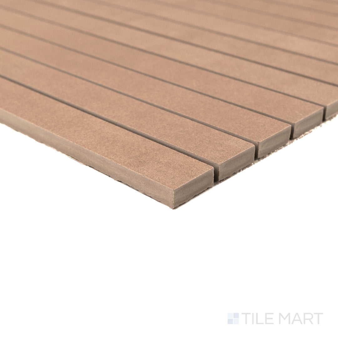 Corner detail of Sahara Cotto 1x12 matte porcelain mosaic showing its earthy tone and smooth elongated edge.