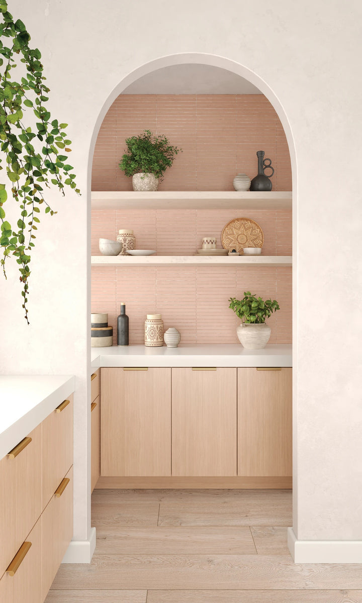 Sahara Rose 1x12 matte porcelain mosaic with narrow pink-toned strips arranged in a stylish surface pattern.