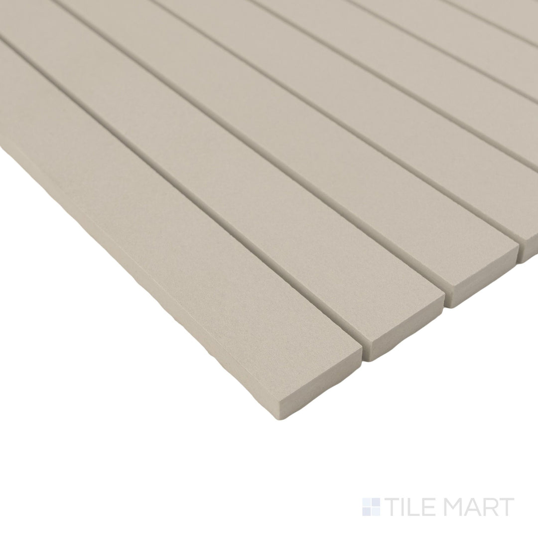 Sahara Grey stacked matte porcelain mosaic shown in corner view highlighting linear form and soft concrete tones