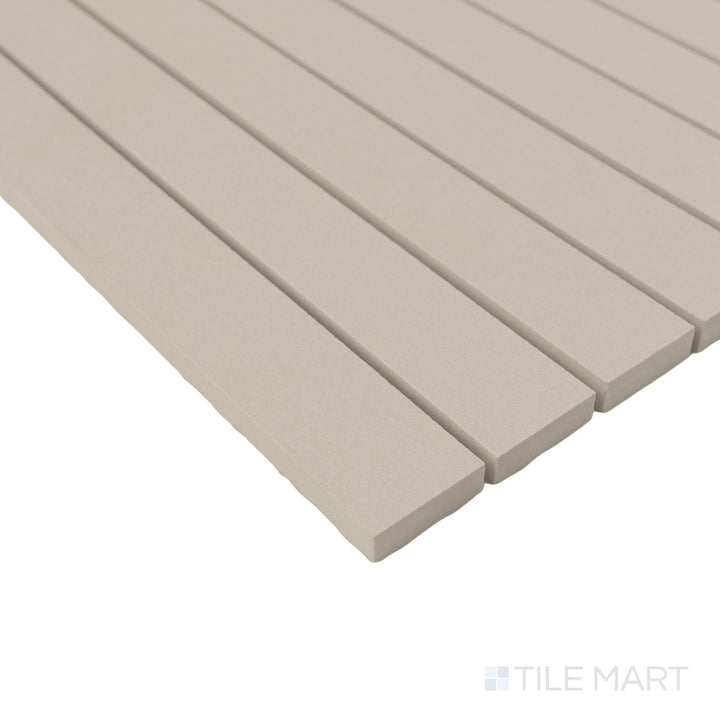 Sahara Grey stacked matte porcelain mosaic shown in corner view highlighting linear form and soft concrete tones