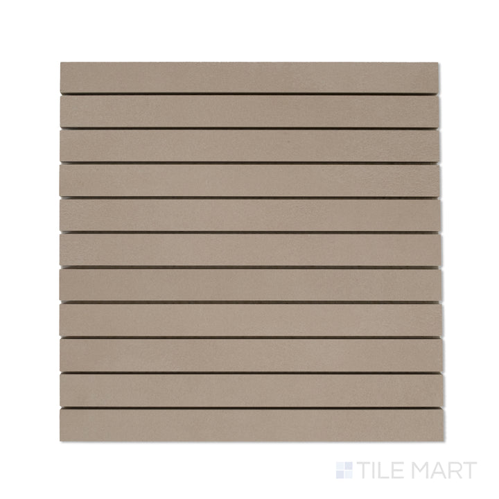Flat-lay shot of Sahara Taupe 1x12 matte porcelain mosaic, showing slim taupe-colored strips in a precise linear configuration.