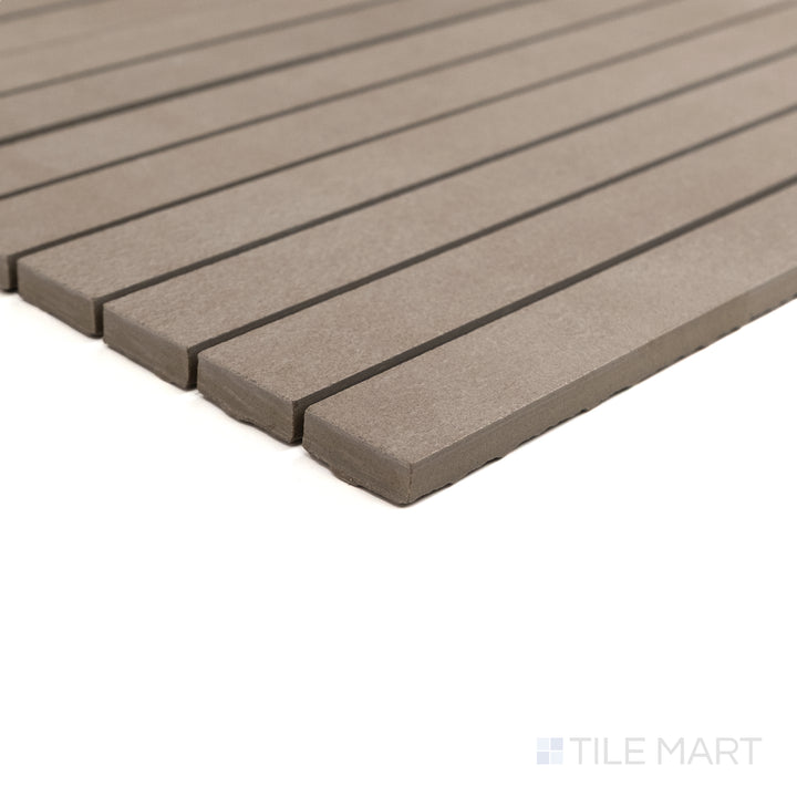 Corner detail of Sahara Taupe 1x12 matte porcelain mosaic highlighting its warm hue and smooth linear finish.