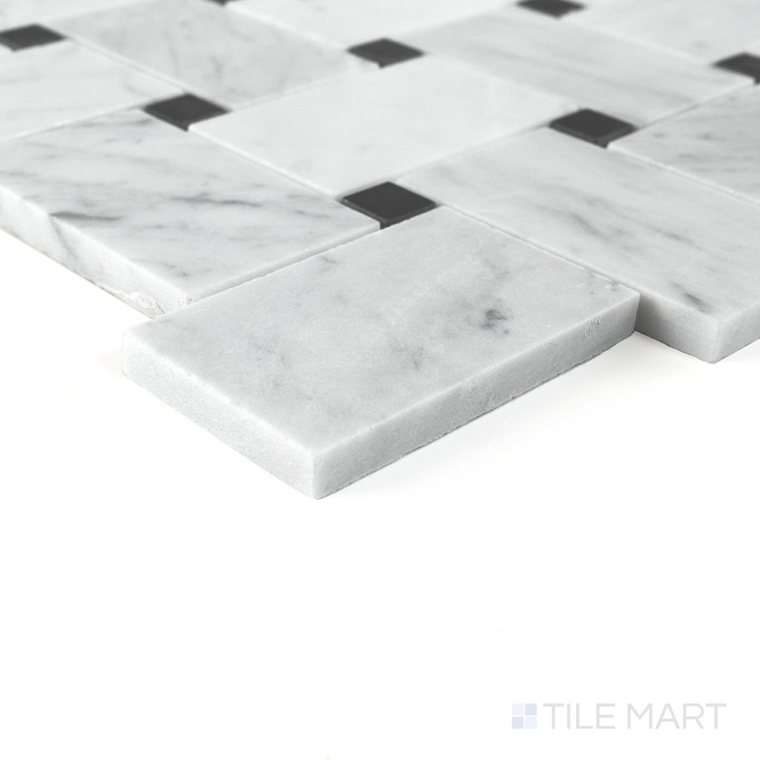 Corner detail of Jumbo Basketweave White Carrara with Absolute Black dot honed marble mosaic highlighting contrast.