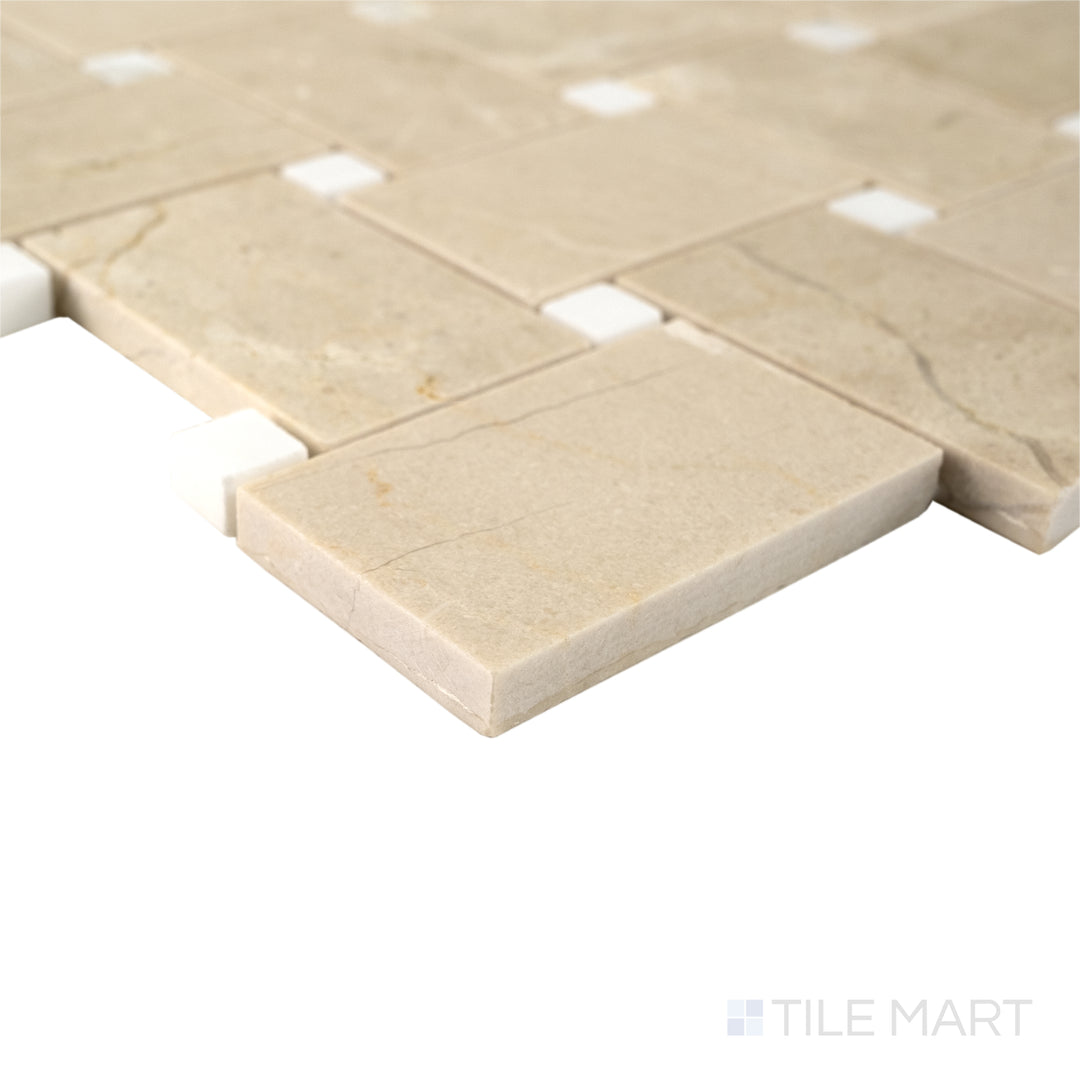 Corner view of Jumbo Basketweave Crema Marfil with Calacatta dot honed marble mosaic showing warm tones and smooth texture.