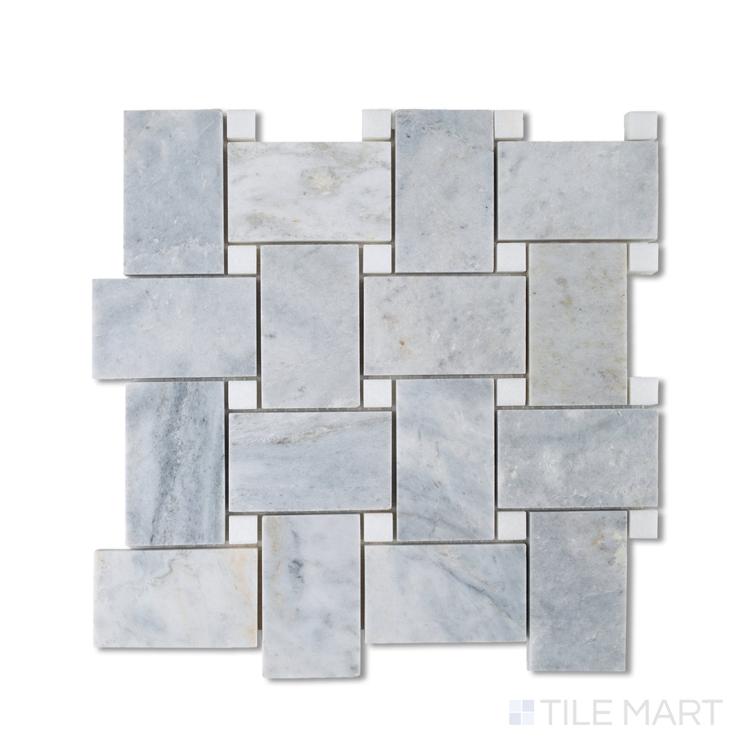 Flat-lay of honed marble basketweave mosaic in Glorious Blue with bright Thassos dots, forming a striking cool-toned interwoven design.