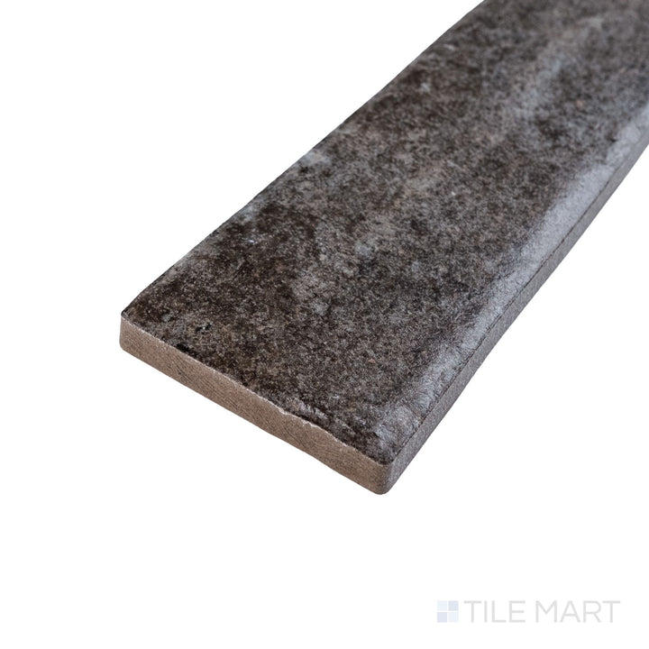 Corner angle of Montana Rock Creek 2.5x10 matte porcelain tile showcasing grounded hues and soft surface detail