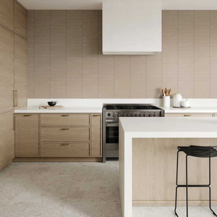 Frammenta White 24x24 matte porcelain tile featured in a bright interior with terrazzo-inspired texture