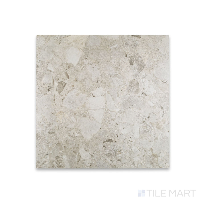 Close-up of Frammenta White 24x24 matte porcelain tile highlighting terrazzo-inspired texture