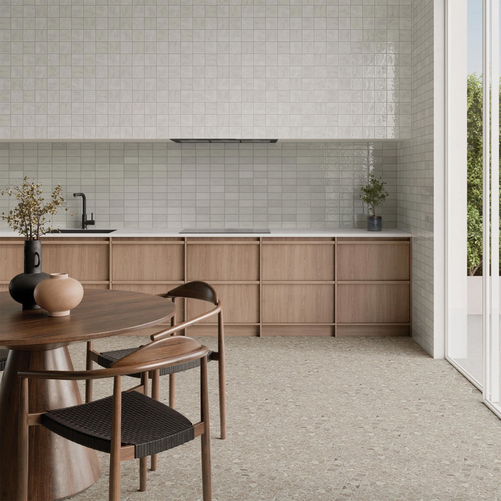 Frammenta Beige 24x24 matte porcelain tile styled in a warm setting highlighting soft aggregate detail