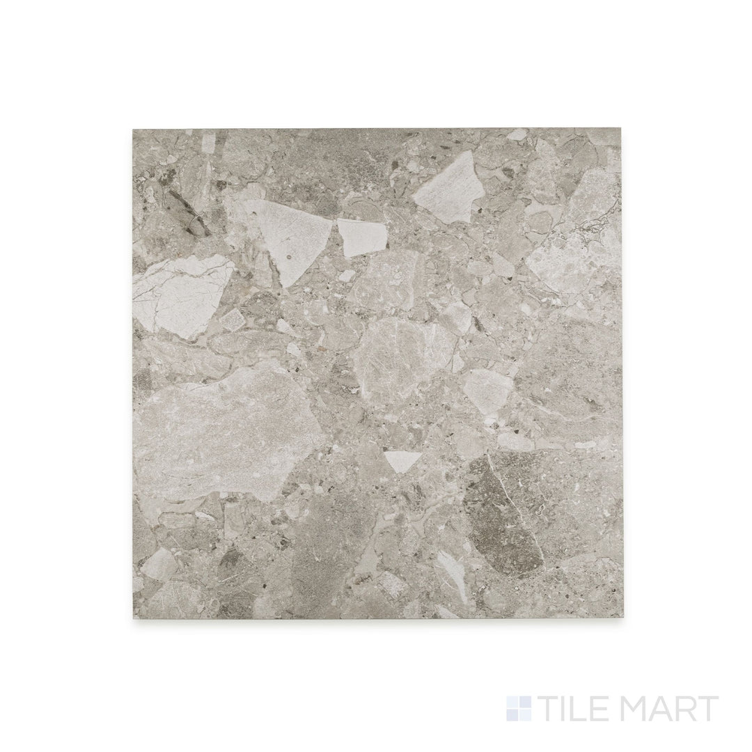 Full-piece detail of Frammenta Light Grey 24x24 matte porcelain tile with subtle tonal movement