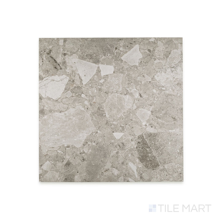 Full-piece detail of Frammenta Light Grey 24x24 matte porcelain tile with subtle tonal movement