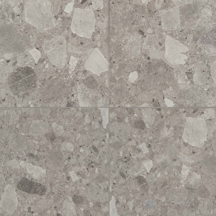 Frammenta Dark Grey 24x24 matte porcelain tile showcasing bold contrast and modern stone character
