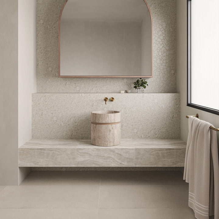 Frammenta White Palladiana mosaic featured in a light-filled setting with organic stone pattern
