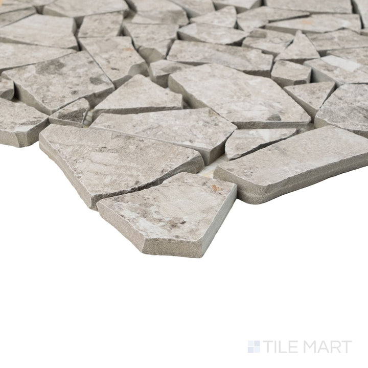 Corner detail of Frammenta Light Grey Palladiana mosaic revealing dynamic variation and angular pieces