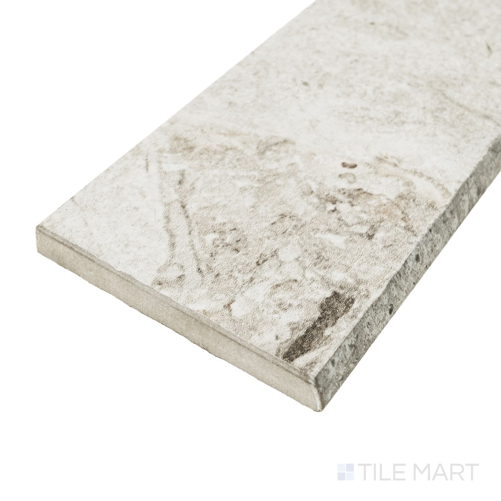 Corner detail of Frammenta White 3x24 matte porcelain bullnose highlighting rounded trim profile