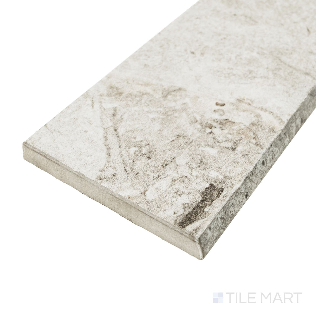 Corner detail of Frammenta White 3x24 matte porcelain bullnose highlighting rounded trim profile