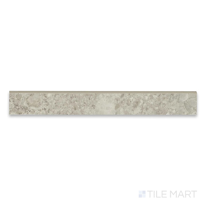 Close view of Frammenta Beige 3x24 matte porcelain bullnose highlighting smooth curved edge