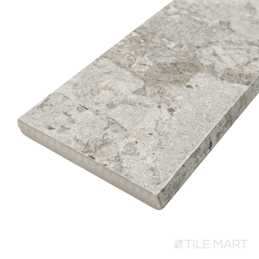 Corner angle of Frammenta Light Grey 3x24 matte porcelain bullnose revealing clean profile and soft matte surface