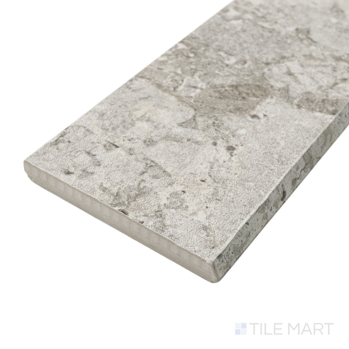 Corner angle of Frammenta Light Grey 3x24 matte porcelain bullnose revealing clean profile and soft matte surface