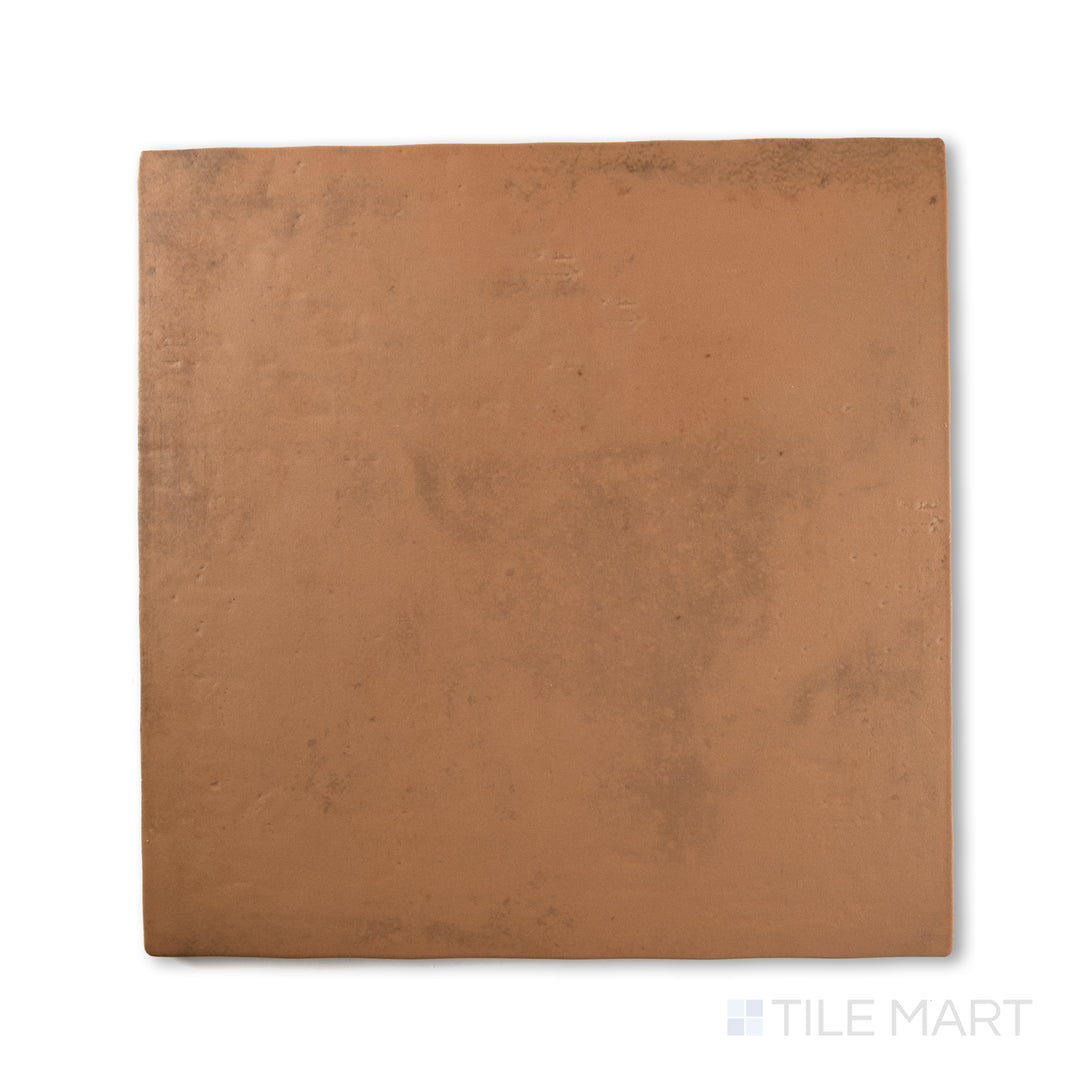 Flat-lay of Cotto Nature Siena 14x14 matte porcelain tile, featuring golden undertones with a weathered look for a rustic, Mediterranean feel.