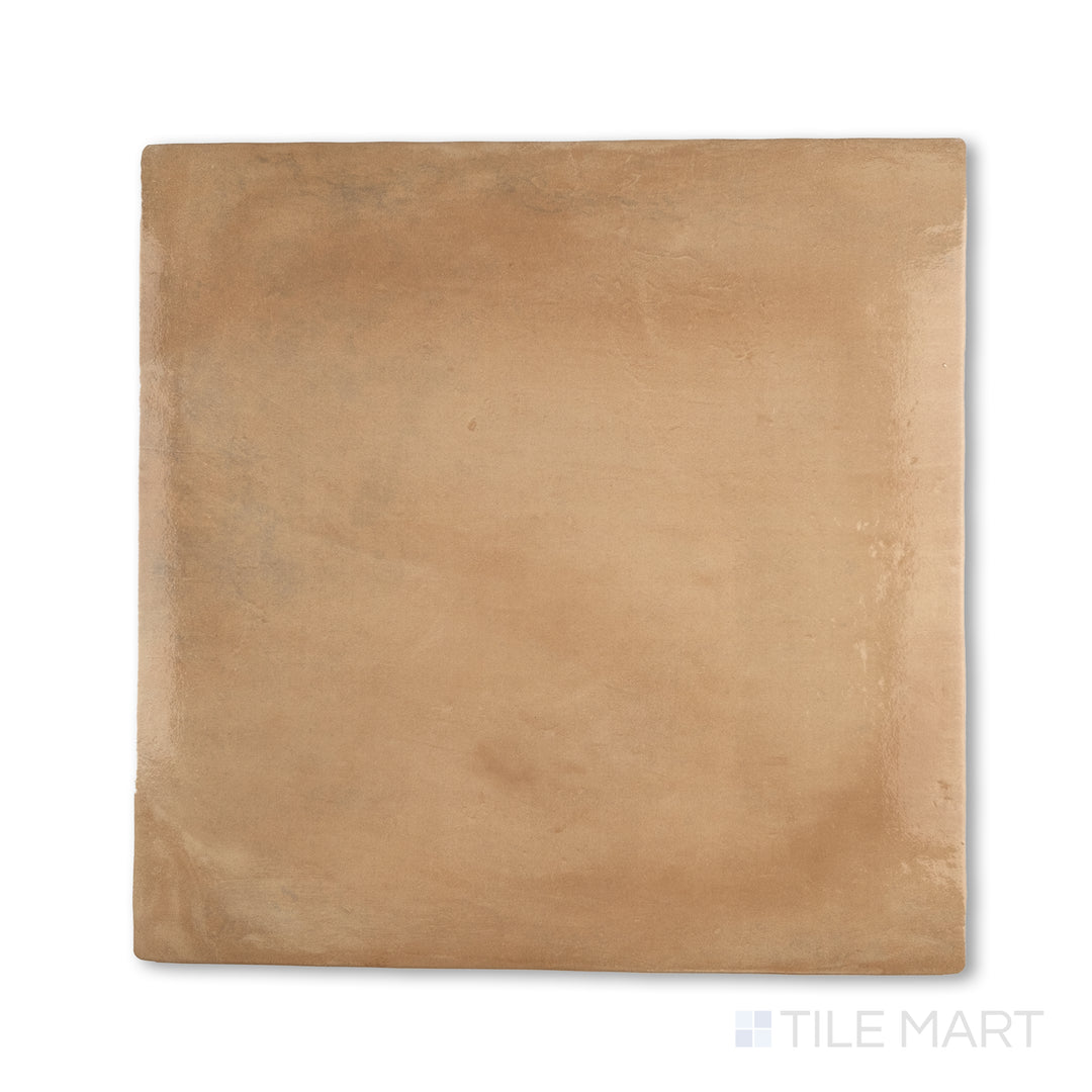 Overhead view of Cotto Nature Cerdena 14x14 gloss porcelain tile, highlighting a reflective surface with warm, clay-inspired tones and traditional character.