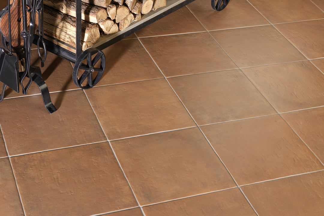 Cotto Nature Siena Gloss Porcelain presented in a refined environment, balancing rich tone with glossy surface depth.