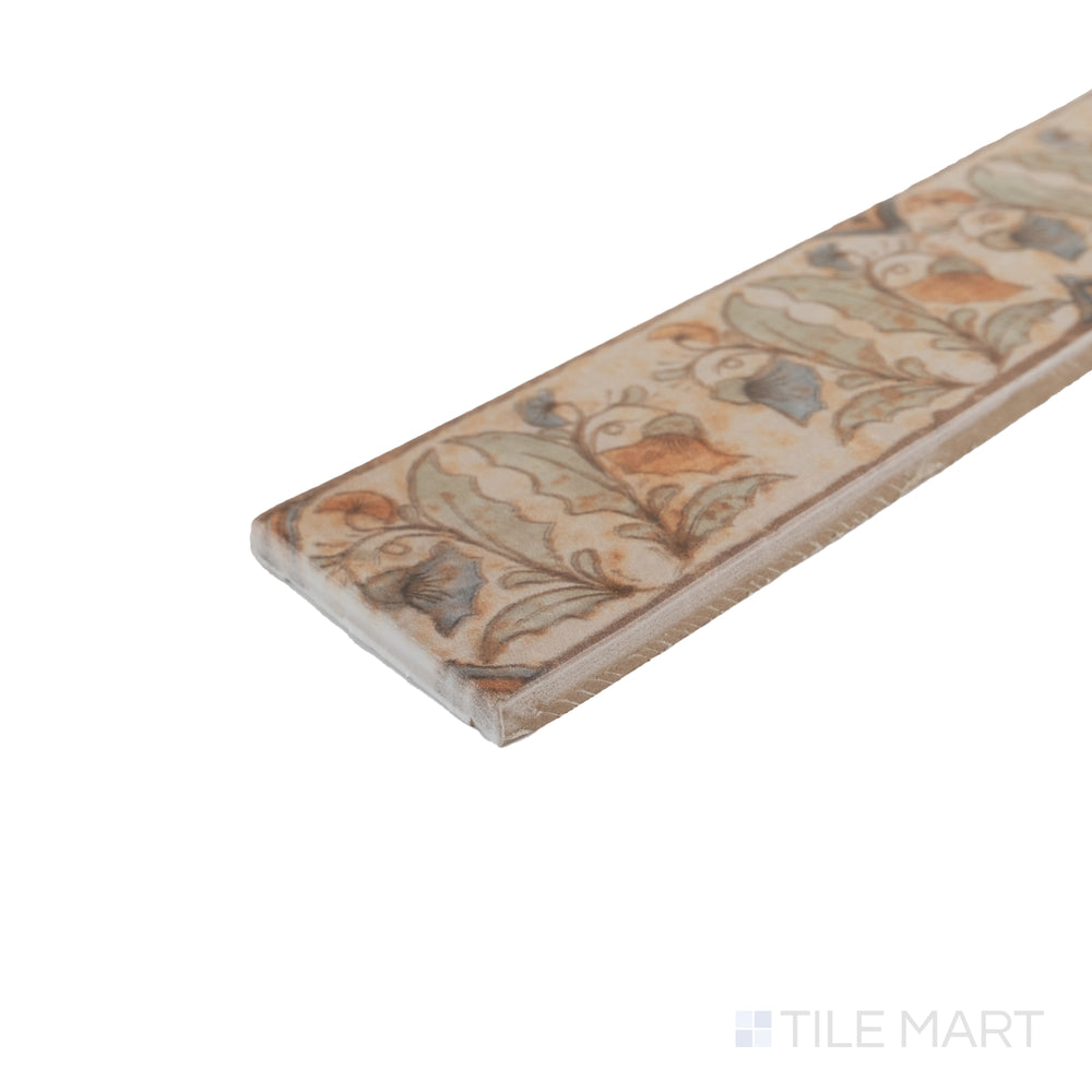 Corner close-up of Cotto Nature Tira Versilia 3x14 deco hand-painted gloss porcelain liner highlighting detailed finish.