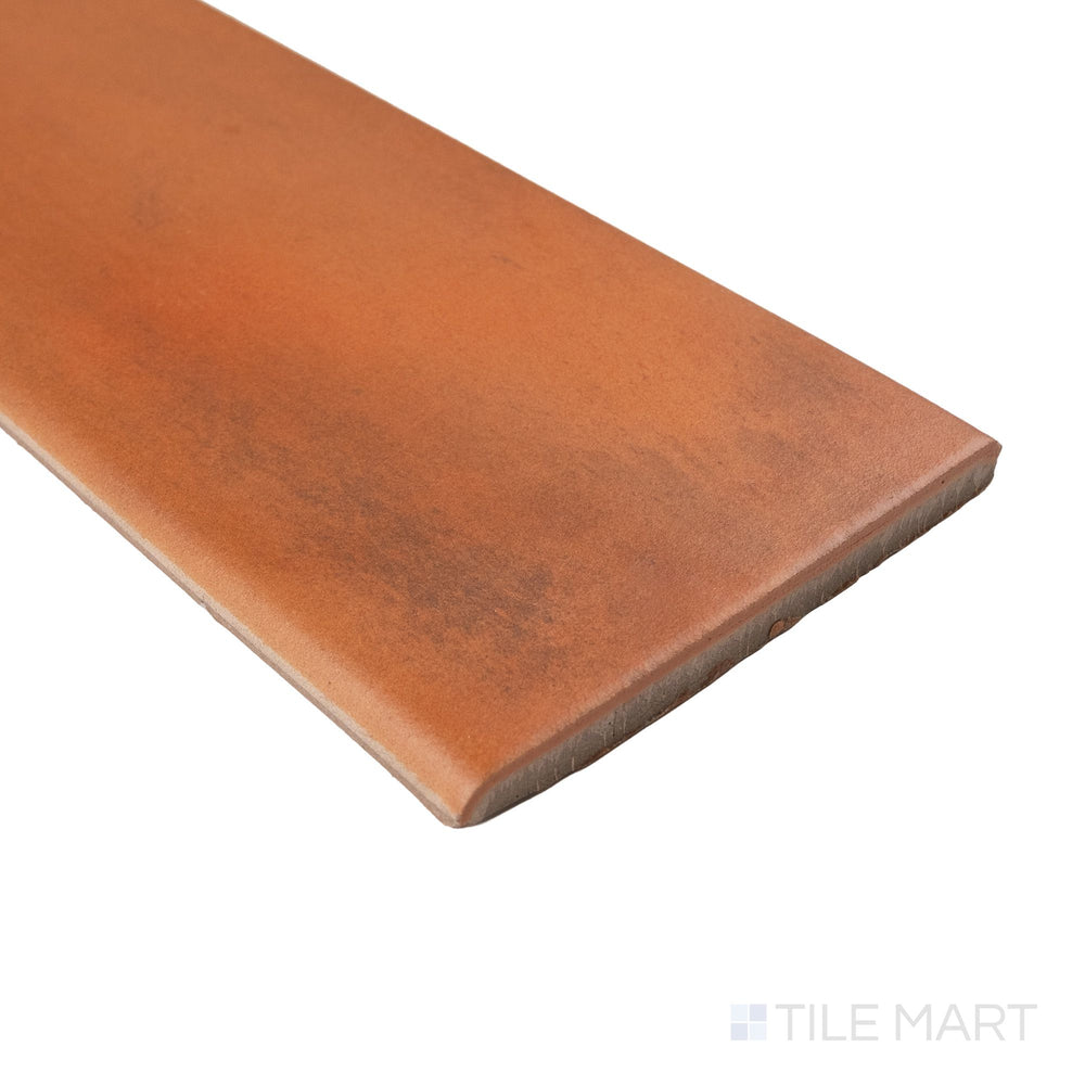 Corner view of Cotto Nature Siena 4x14 matte porcelain bullnose highlighting smooth curved trim profile